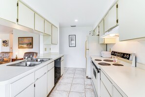 Fridge, stovetop, dishwasher, coffee/tea maker