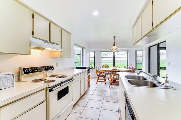 Fridge, stovetop, dishwasher, coffee/tea maker