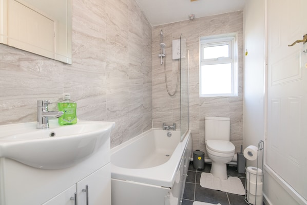 Shower, hair dryer, towels, soap