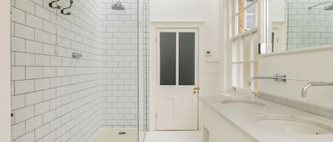 Shower, hair dryer, towels, toilet paper