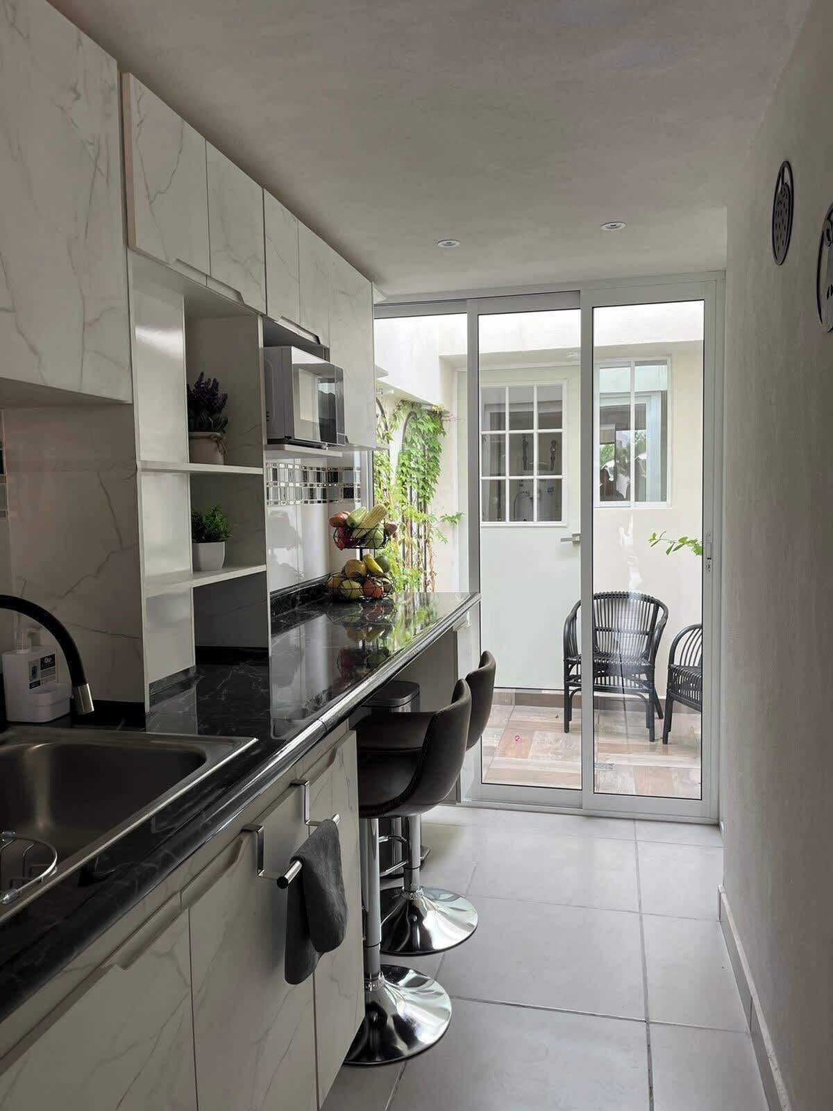 Fridge, microwave, stovetop, coffee/tea maker