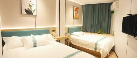 A hotel room with two beds, a flat-screen TV, and a large window with curtains.