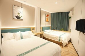 A hotel room with two beds, a flat-screen TV, and a large window with curtains. - Shanghai Xinnuo Hotel (Shanghai)