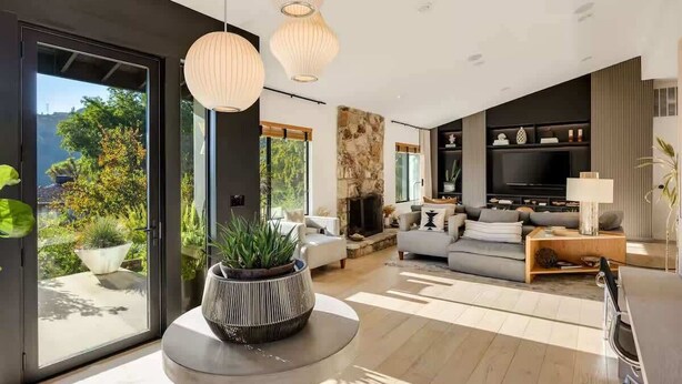 A modern living room with a fireplace, a sofa set, and a television. - Hollywood Hills Villa by Universal-Pool-Dogs OK (Los Angeles)