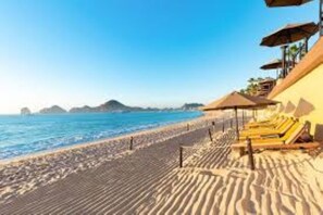 On the beach, sun loungers, beach towels