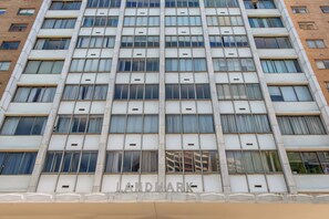 Landmark building with a contemporary design, featuring a grid of windows and a prominent entrance.