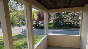 A corner room with large windows overlooking a street.