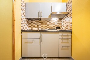 Microwave, stovetop, coffee/tea maker, electric kettle