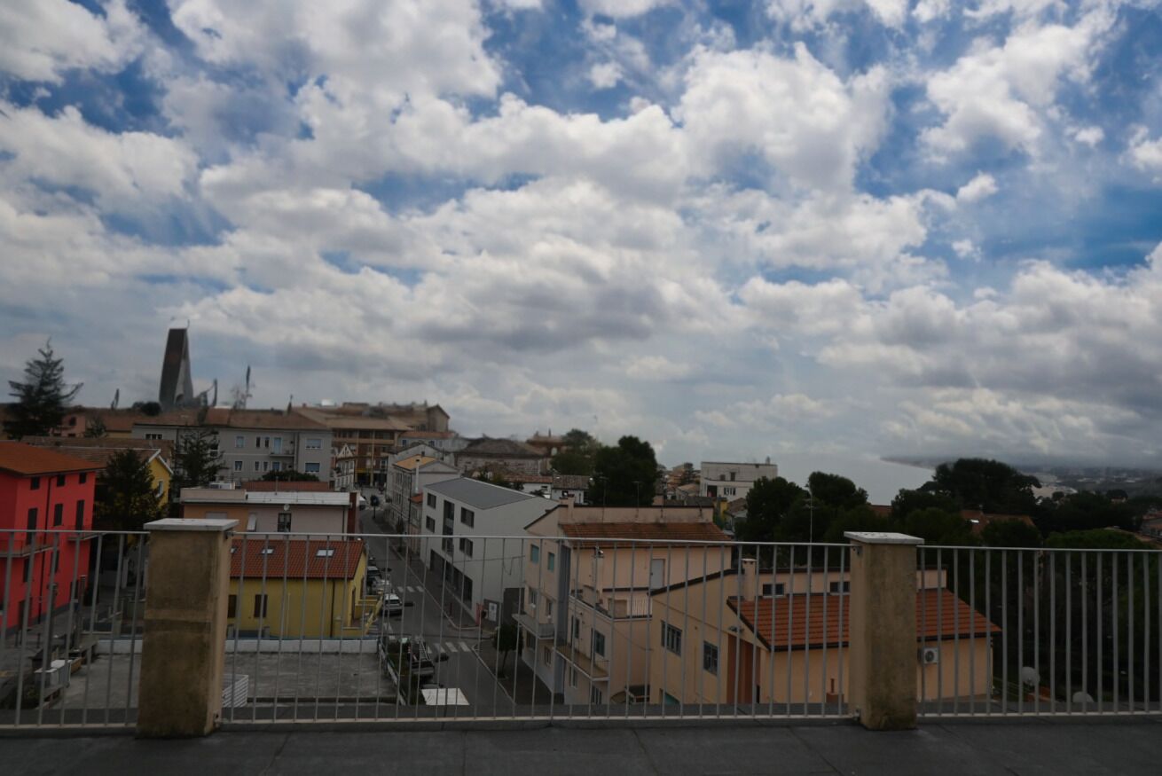 A view of a town with buildings and a clear sky.