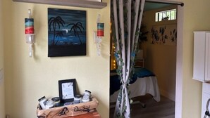 A bedroom with a bed, a nightstand, a painting, and a curtain. - Vacation Rental, Spa & Salt Room
Table Rock State Park
Fire-Pit ,Pet Friendly (Pickens)