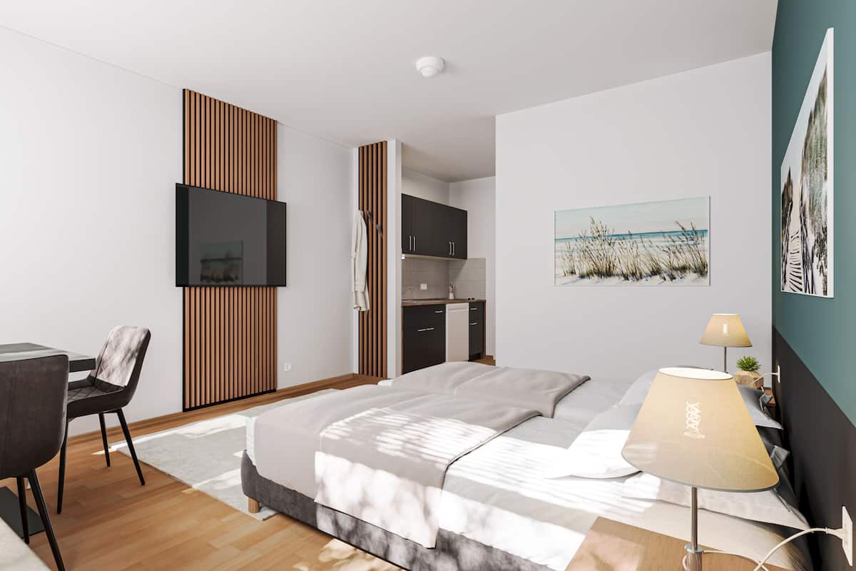 Un dormitorio moderno con cama, mesita de noche, lámpara y vistas a la cocina.