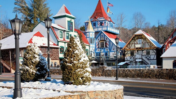 A traditional European-style building with a red roof, a blue and white facade, and a star on top. - Cozy cabin and TUBING!  Swim, Horses, hiking, lake-3 mi from Helen! Relax!  (Cleveland)