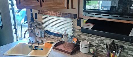 Fridge, microwave, stovetop, coffee/tea maker