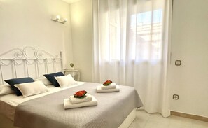 2 habitaciones, tabla de planchar con plancha y ropa de cama