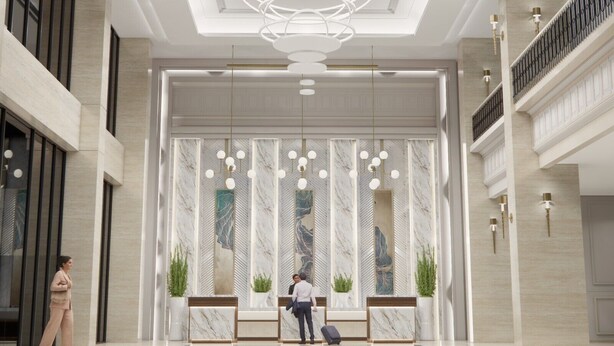 A spacious lobby with a modern chandelier, marble reception desk, and a high ceiling with recessed lighting. - Grand Travello Hotel Bekasi (Bekasi)