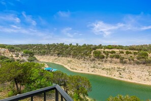 Surrounded by a serene landscape, this peaceful retreat offers a tranquil atmosphere with a meandering river and rolling hills.