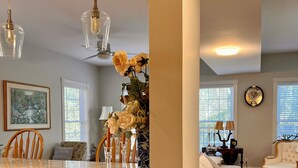 A modern kitchen with a marble countertop, white cabinetry, and pendant lighting. - Stately 5-bedroom estate in beautiful Prince Edward with fitness room, AC (Prince Edward)