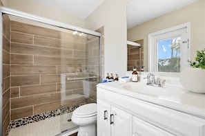 Shower, hair dryer, towels, soap