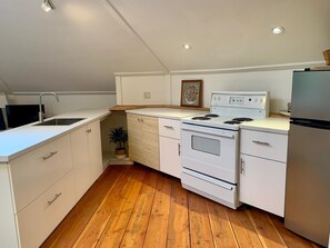 Fridge, stovetop, coffee/tea maker, electric kettle