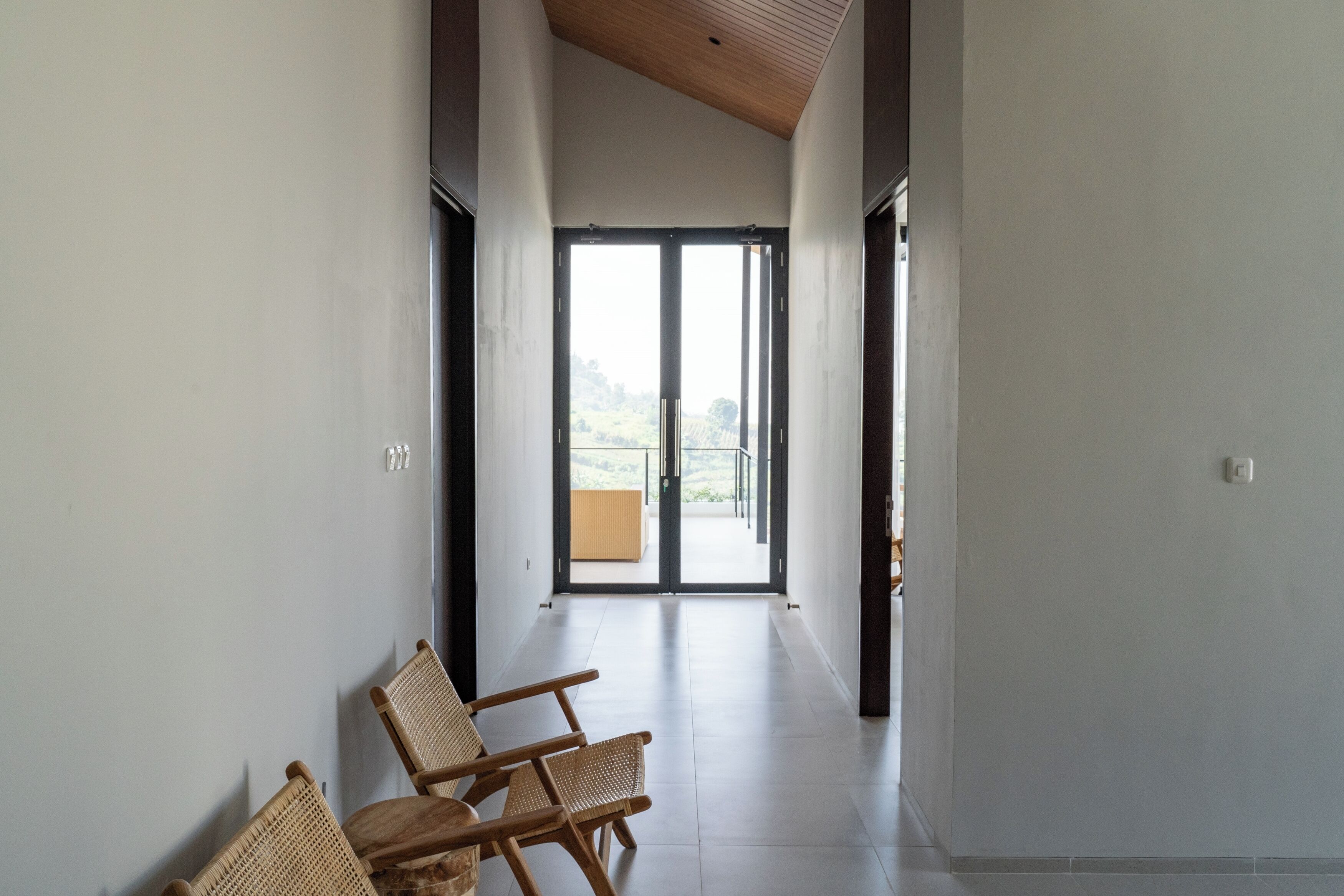 A hallway with a view to a balcony.