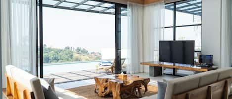Deluxe Villa, Mountain View | Living room | Flat-screen TV
