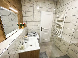 Shower, hair dryer, towels, soap