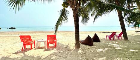 On the beach, white sand, sun loungers