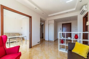 Living area - GuestHost - Bright apartment of about 100 sqm, perfect for 3 people, located on the seventh floor of a building with elevator (NOT suitable for disabled people - some steps to access it).The property is located in a quiet residential area well connected  (Rome)