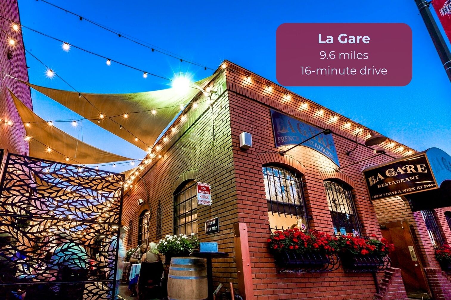 La Gare restaurant with a sign indicating a 9.6-mile drive and a 16-minute drive time.
