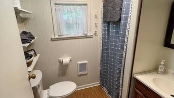 Shower, towels, soap, toilet paper