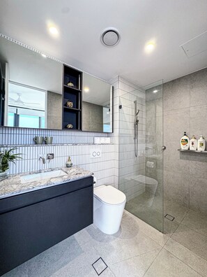 Shower, hair dryer, towels, soap