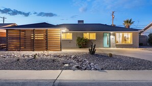 A modern house with a sloped roof, a front porch, and a well-maintained garden with rocks and cacti. - Private Pool + Outdoor Oasis • 5mins to Old Town | Indianola Oasis by AvantStay (Scottsdale)