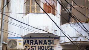 A building with a sign reading "VARANASI REST HOUSE" and a yellow door labeled "AC ROOM". - Varanasi Rest House  (Varanasi)
