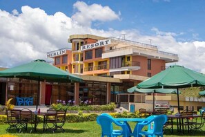 A multi-story building with a sign reading "MERLIN RESORT". - Merlin Resort Naivasha (Naivasha)