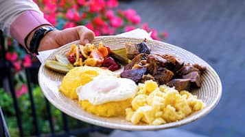 A plate of food including eggs, meat, and vegetables.