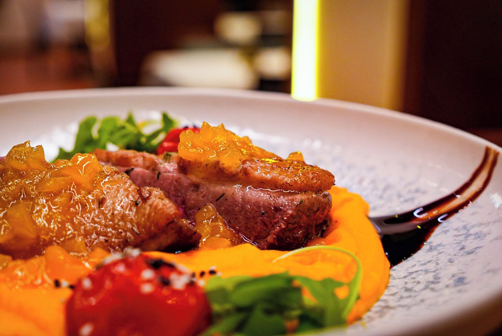 A plate of food with meat and vegetables.