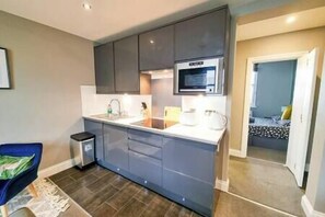 Fridge, microwave, stovetop, cookware/dishes/utensils