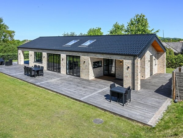 A modern house with a covered patio, large windows, and a sloped roof. - "Tähti" - 425m from the sea by Interhome (Føllenslev)