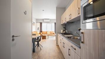 Fridge, microwave, stovetop, coffee/tea maker