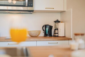 Fridge, microwave, stovetop, coffee/tea maker