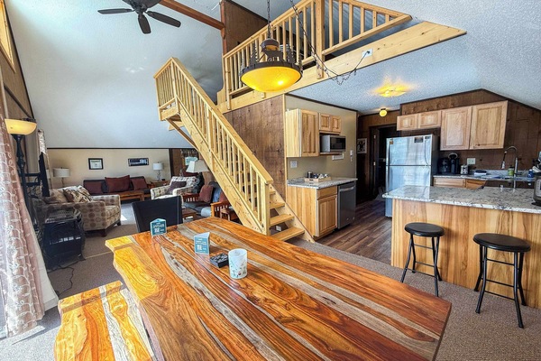 View from the dining room of the kitchen, loft, dining room and living room space