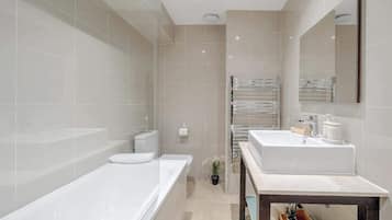 Shower, hair dryer, towels, shampoo