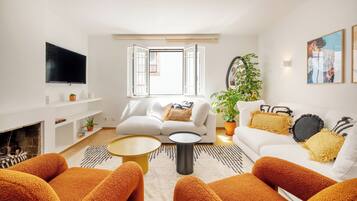 Apartment, Beachside | Living area | Flat-screen TV