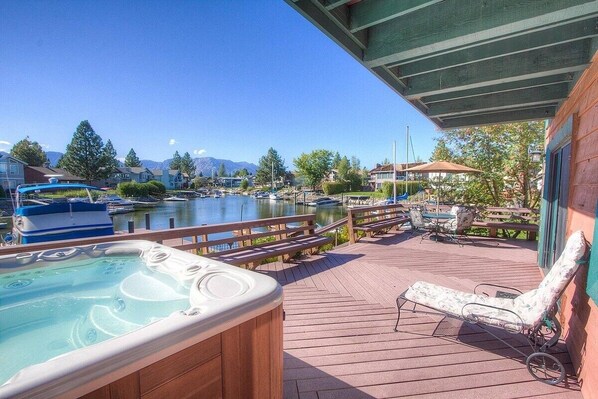 Relax on the deck with a hot tub, lounge chairs, and breathtaking views of the marina and surrounding mountains.
