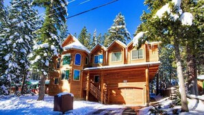 A log cabin with multiple rooms, a garage, and a staircase leading to the upper floor. - Coh1669 - Hawk's View Hideaway 6 Bedroom Home (South Lake Tahoe)