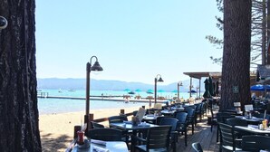 A seaside restaurant with outdoor seating overlooking the beach and ocean. - Coh1669 - Hawk's View Hideaway 6 Bedroom Home (South Lake Tahoe)
