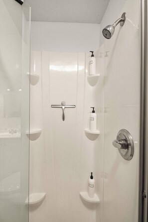 Shower, hair dryer, towels, shampoo