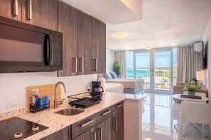 Fridge, microwave, stovetop, coffee/tea maker