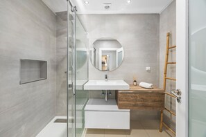 Shower, hair dryer, towels, toilet paper