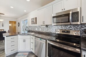 Microwave, stovetop, dishwasher, coffee/tea maker